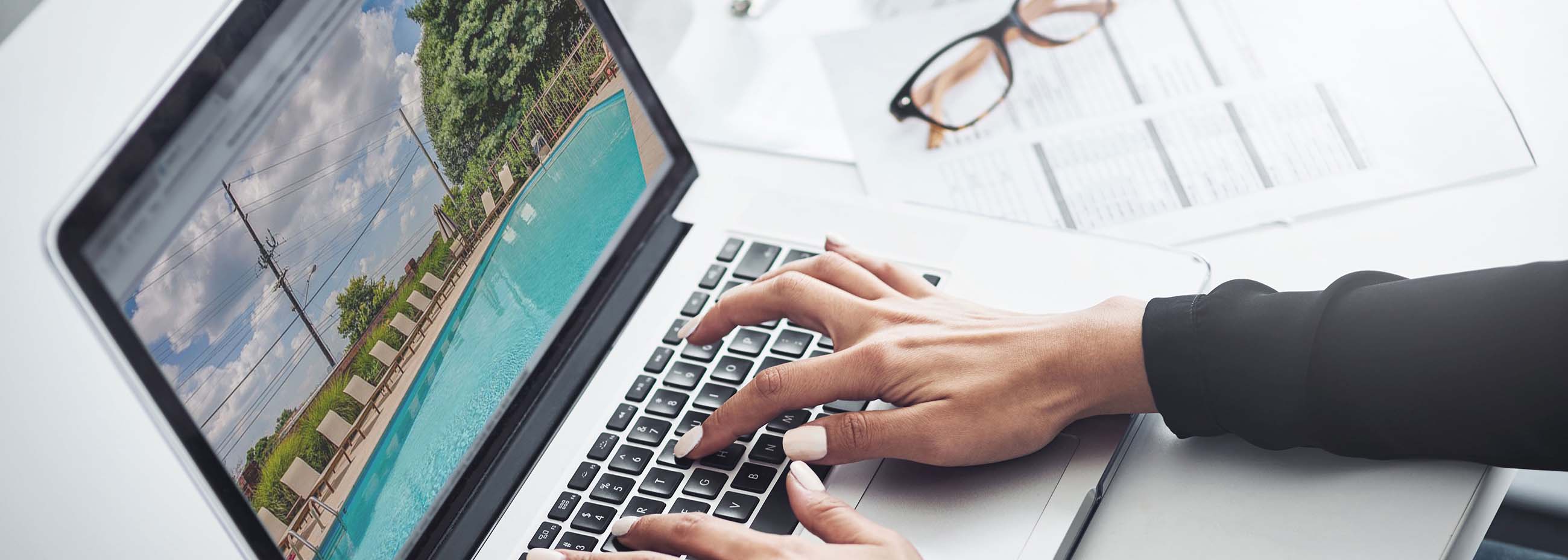 woman typing on laptop keyboard